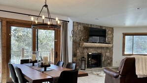 A spacious living area with a stone fireplace, a dining table with chairs, a leather sofa, and a TV mounted on the wall. - REMODELED Cozy Mountain Modern Ski-in 1 block to Heart of Breckenridge
Hot Tubs (Breckenridge)