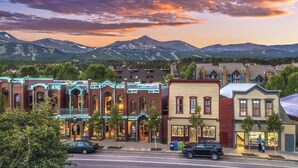 A street view of a town with historic buildings, a mountain range in the background, and a sunset sky. - REMODELED Cozy Mountain Modern Ski-in 1 block to Heart of Breckenridge
Hot Tubs (Breckenridge)