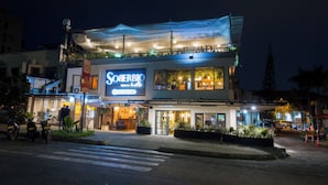 A two-story hotel with a prominent sign reading "Sorrento".