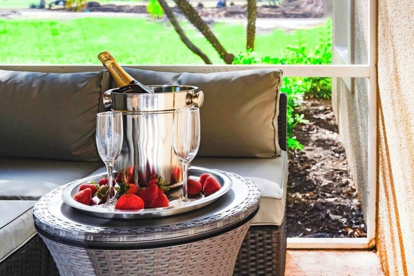 Relax in our Outdoor Livingroom Patio with TV, overlooking PGA Clubhouse.