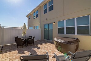 Relax outdoors with a barbecue grill and comfortable seating on the patio.