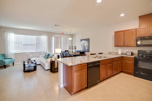 Apartment, Multiple Beds (5133 Compass Bay) | Private kitchen | Fridge, microwave, stovetop, dishwasher