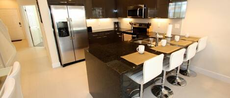 Apartamento, várias camas (1521 Dream) | Cozinha privada | Geladeira, micro-ondas, cooktop, lava-louças