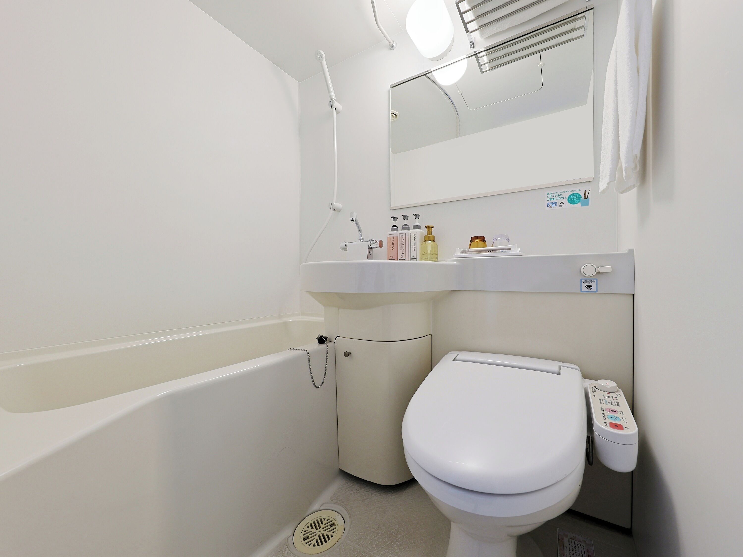 Combined shower/tub, free toiletries, hair dryer, slippers