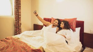 A couple in bed taking a selfie. - Nilakma Lagoon (Negombo)