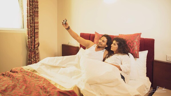 A couple in bed taking a selfie. - Nilakma Lagoon (Negombo)