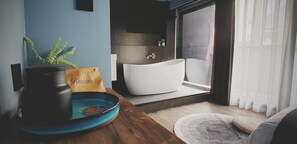 A modern bathroom with a freestanding bathtub, a sink, and a window with blinds. - Leo 111 - Yancheng Pier 2 (Kaohsiung)