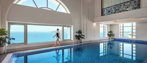 Indoor pool, open 8:00 AM to 9:00 PM, pool loungers