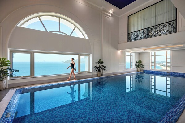 Indoor pool, open 8:00 AM to 9:00 PM, pool loungers