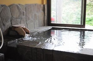 Separate bathtub and shower, free toiletries, hair dryer, slippers