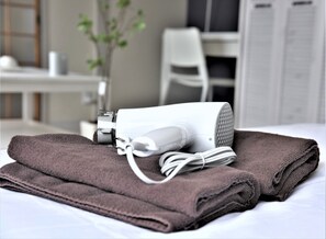Hair dryer, towels, shampoo
