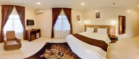 Deluxe Room | 1 bedroom, desk, blackout curtains, iron/ironing board