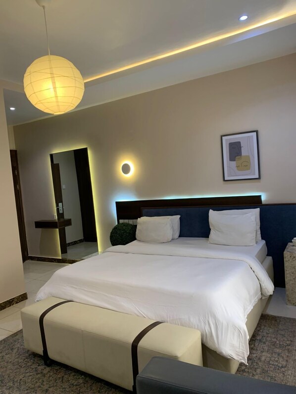 Deluxe Room | Desk, blackout curtains, iron/ironing board, free WiFi