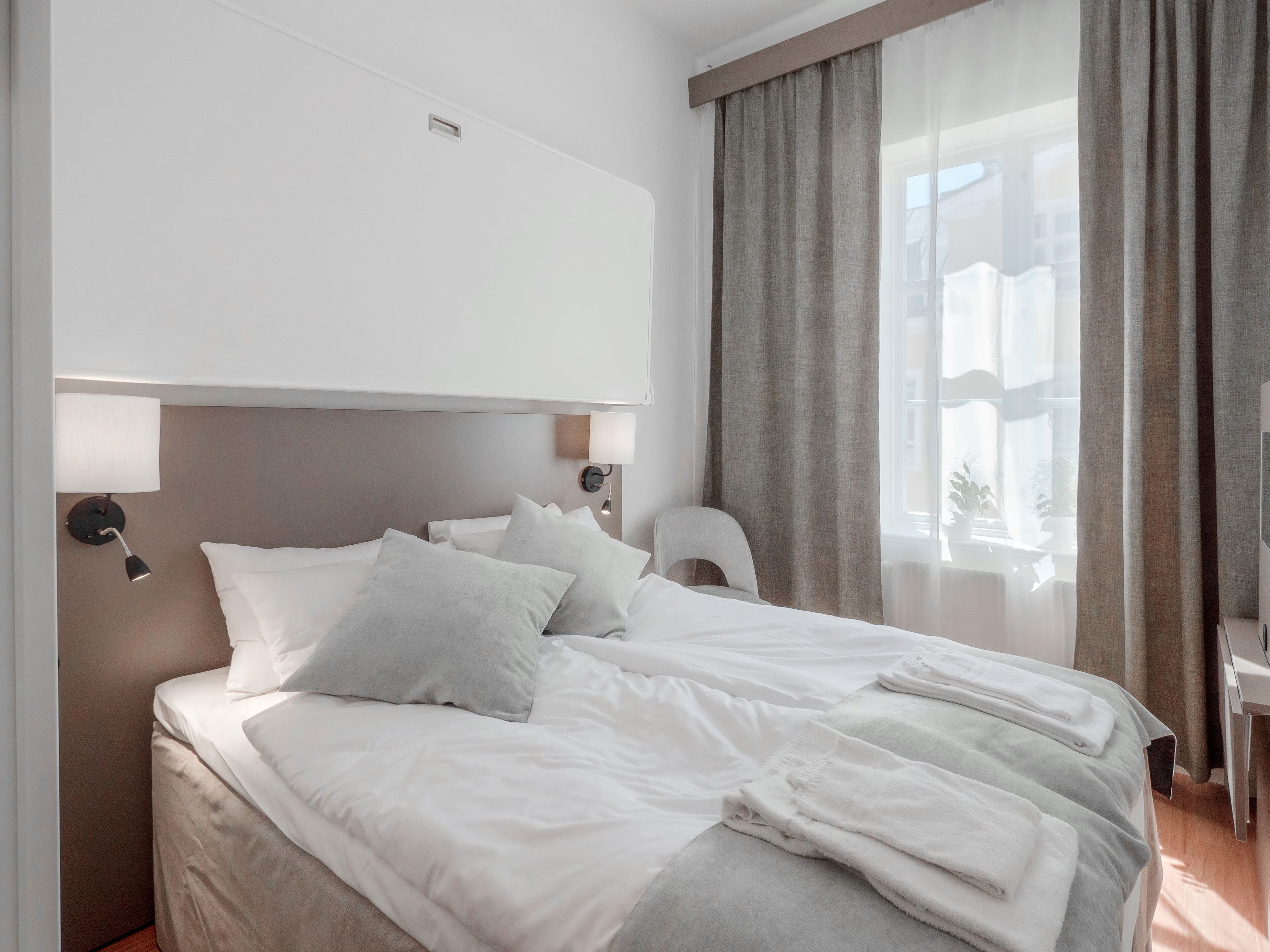 compact room with small bathroom | 1 bedroom, desk, blackout curtains, free wifi