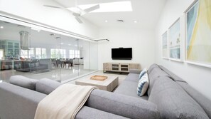 Exclusive Condo | Living area | Plasma TV - Laguna Del Mar (Seven Mile Beach)