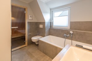 Luxury Condo | Bathroom | Shower, hair dryer, towels, soap