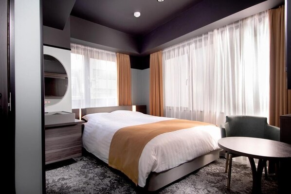 Blackout curtains, soundproofing, free WiFi, bed sheets