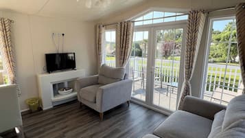 Signature 2 Bedroom | Living area | 42-inch Smart TV with satellite channels, streaming services