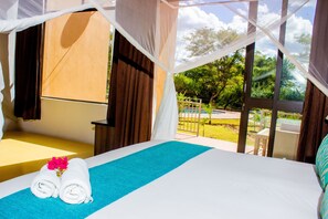 Family Room | In-room safe, desk, laptop workspace, blackout drapes - Wild View Resort (Kasane)