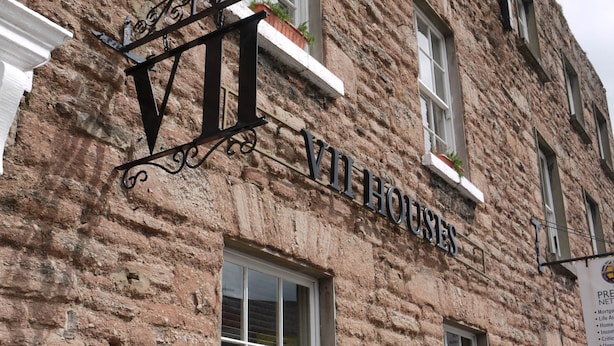 A brick building with a sign reading "VIH HOUSE". - 7 Houses (Armagh)