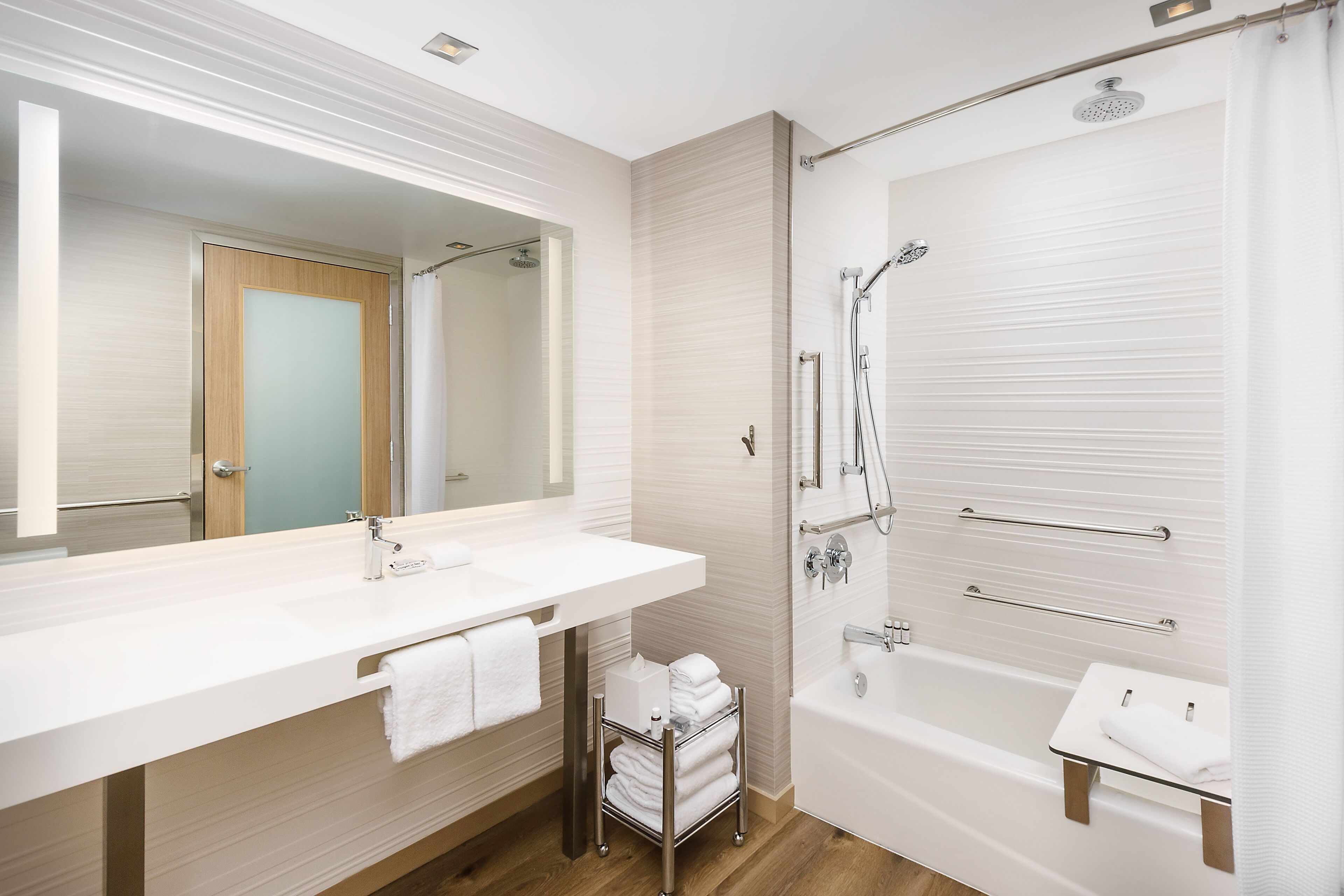 designer toiletries, hair dryer, towels, soap