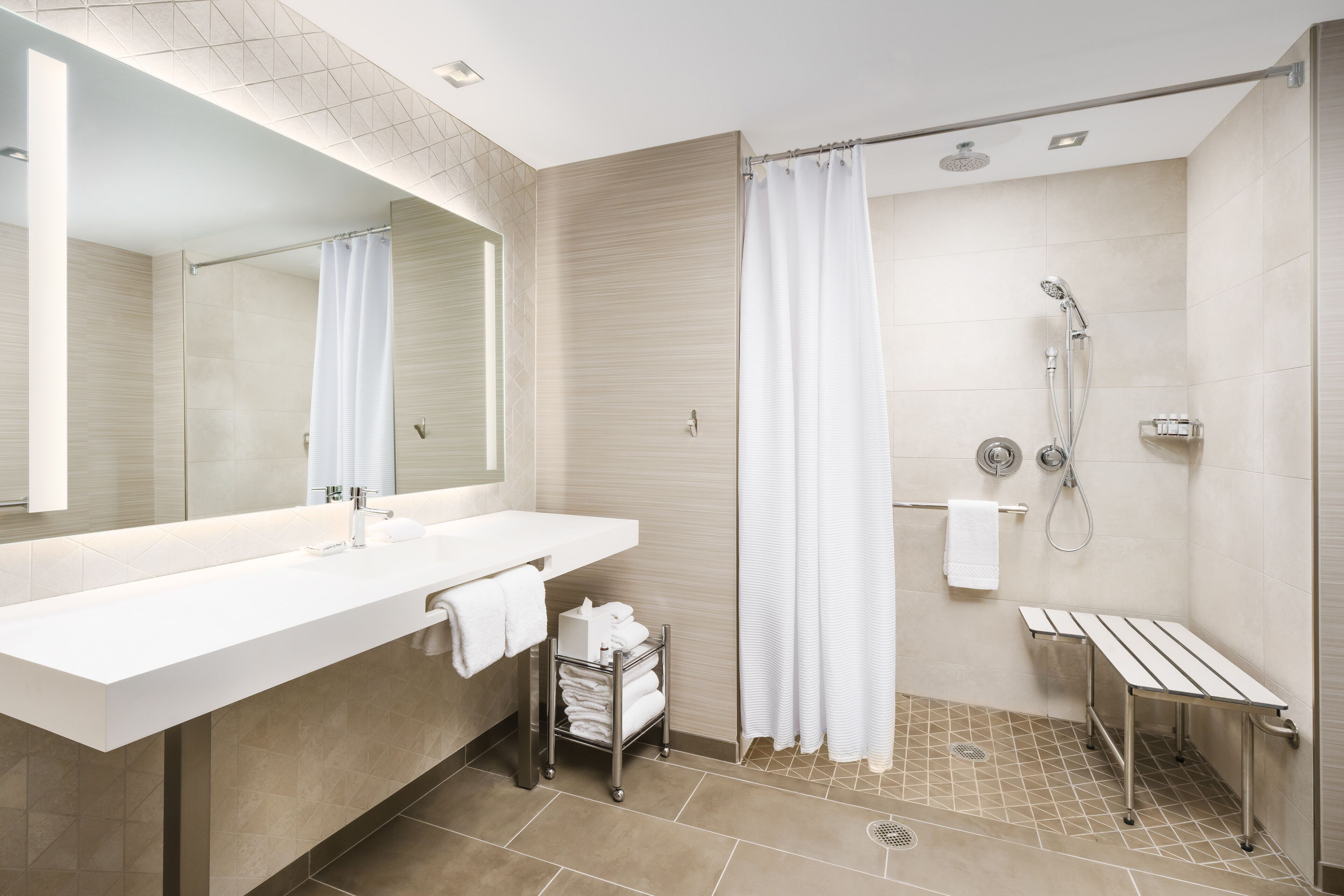 designer toiletries, hair dryer, towels, soap