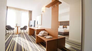 Deluxe Twin Room | Minibar, desk, laptop workspace, blackout drapes
