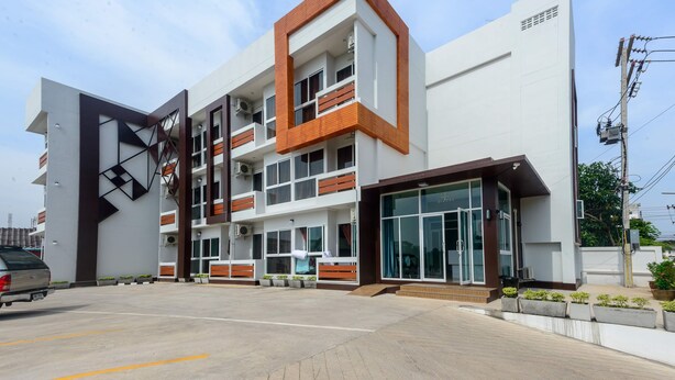 A modern building with a white facade, multiple balconies, and large windows. - O2 Hotel Sakonnakhon (Sakon Nakhon)