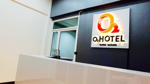 A hotel sign with the name "O2 HOTEL" and "SAKON NAKHON" on a dark wall. - O2 Hotel Sakonnakhon (Sakon Nakhon)
