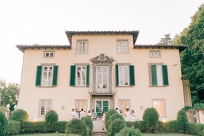 A large, two-story building with a symmetrical facade, green shutters, and a central balcony. - RENAISSANCE WINERY VILLA AMONG THE VINEYARDS, 9 BEDROOMS, 7 BATHS, WIFI, AIR CON (Lucca)