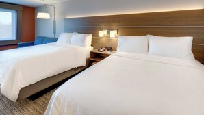 A hotel room with two beds, a nightstand, a lamp, and a window. - Holiday Inn Express Middletown-Goshen (Middletown)