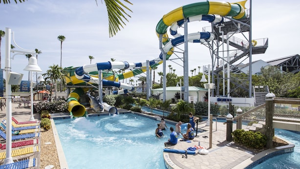 A water park with multiple slides and a pool area. - Waterfront Condo+4 FREE Waterpark Passes-Walk to Beach-Family Favorite-Sleeps 8 (Indian Rocks Beach)