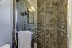 Combined shower/tub, hair dryer, towels, soap