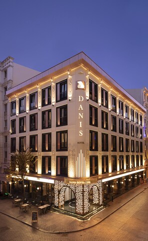A multi-story hotel with a prominent vertical sign reading "DANIS HOTEL." - Danis Hotel & Spa Istanbul - Old City (Istanbul)
