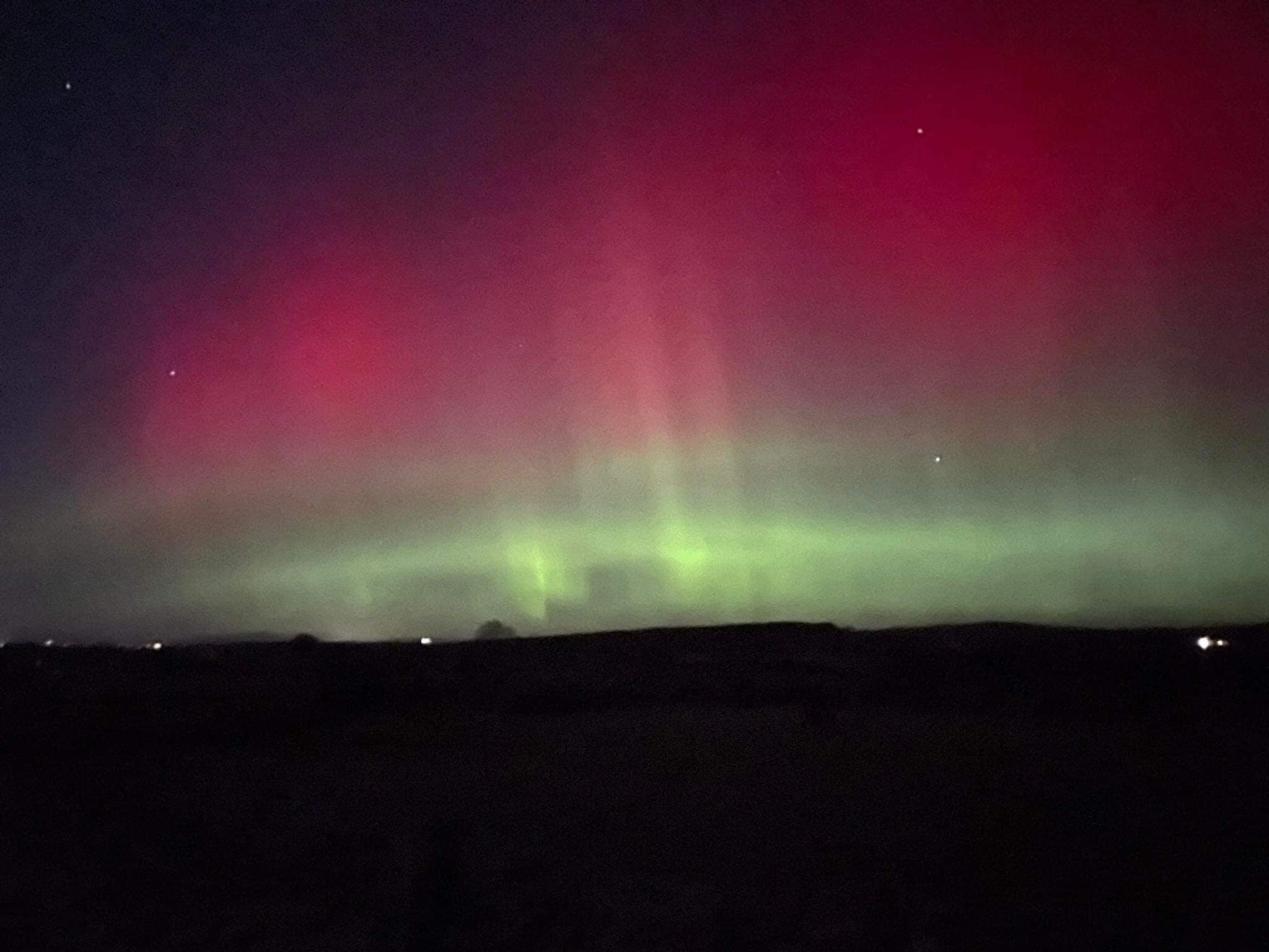 A night sky with the aurora borealis.