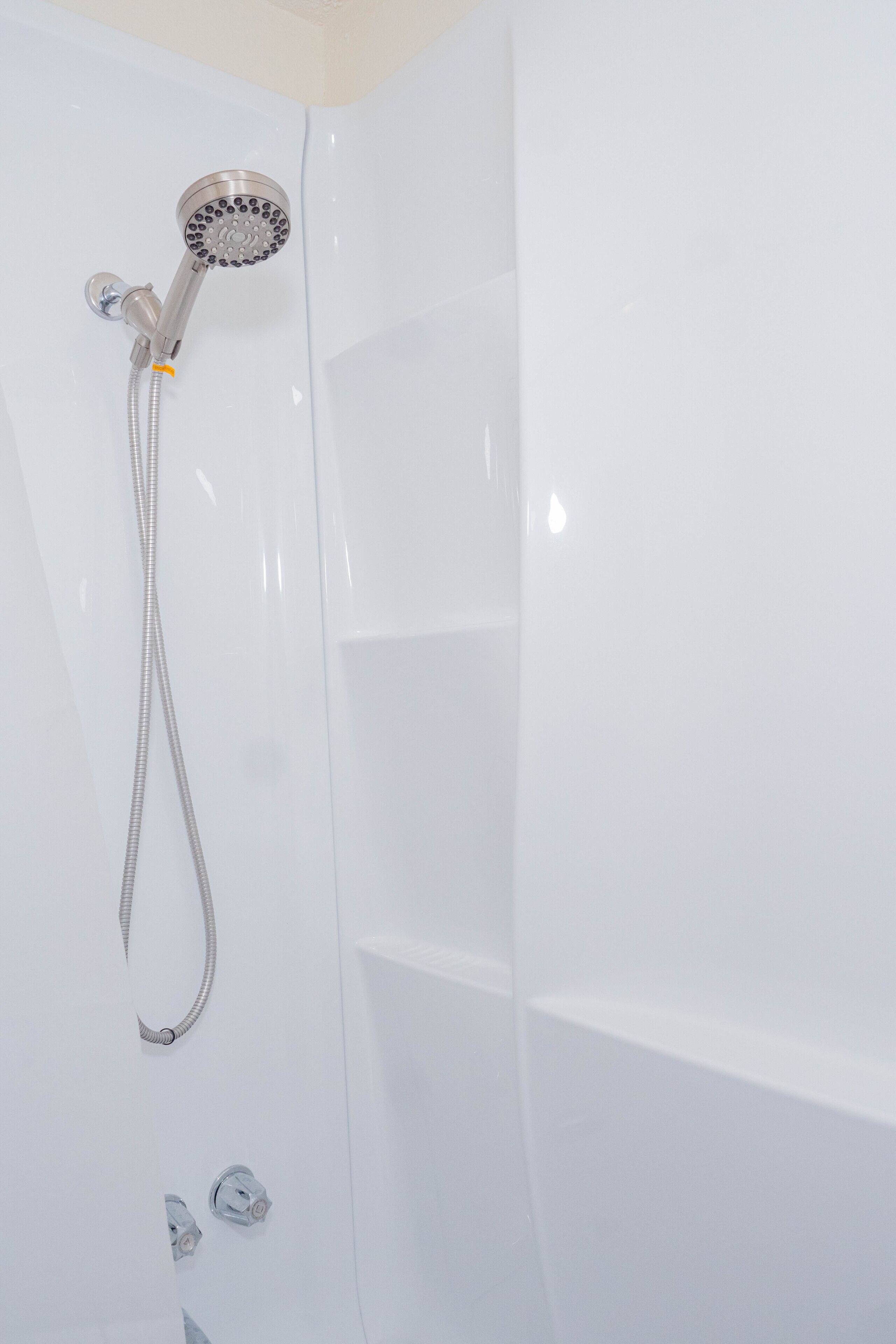 Combined shower/bathtub, hair dryer, towels, soap