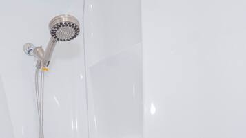 Combined shower/bathtub, hair dryer, towels, soap