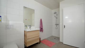 Shower, rainfall showerhead, hair dryer, towels