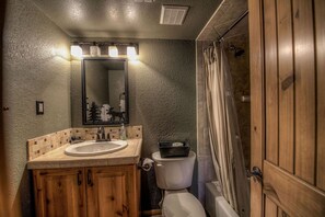 Combined shower/tub, hair dryer, towels, soap