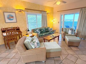 TV - Experience the charm of Le Lapin – a family-friendly retreat featuring stunning dual views, a refreshing pool, and comfortable air conditioning. Perfect for unforgettable moments with loved ones! (St John)