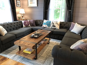 Relax in this inviting living space with a comfortable sofa, coffee table, and lamp.