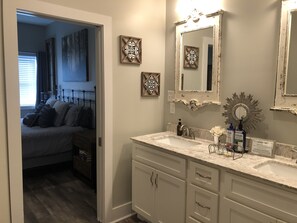 Combined shower/bathtub, towels, soap, toilet paper