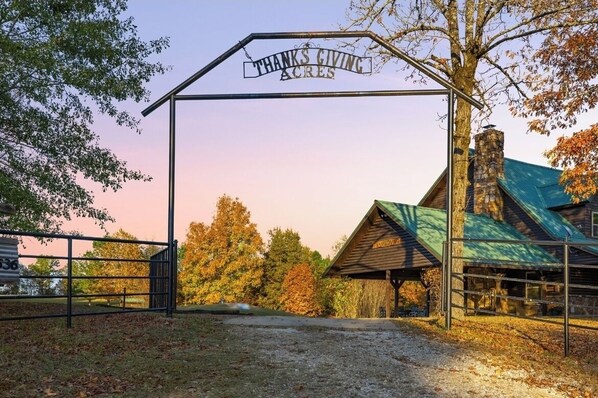A rustic barn with a metal gate labeled "THANKS GIVING ACRES." - Secluded and Spacious in Southeast Oklahoma (Smithville)