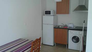 Fridge, microwave, toaster, cookware/dishes/utensils