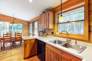 Enjoy meals in this kitchen with a dining area, double sink, and dishwasher.