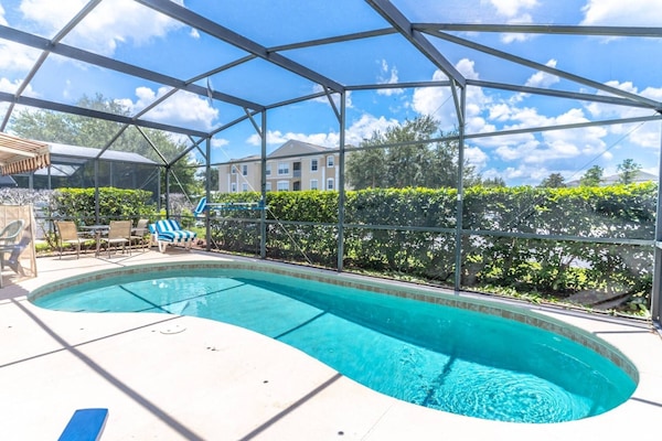 Enjoy This Fabulous Pool With Privacy Hedges All Around