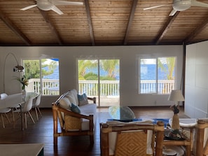 Livingroom with ocean views, ceiling fans