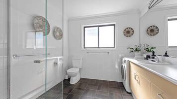 Shower, hair dryer, towels, soap