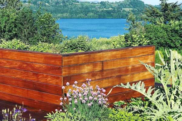 Deck with lake + mountain view