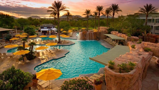 A resort pool area with multiple pools, sun loungers, and umbrellas. - Marriott Canyon Villas - Two Bedrooms-Direct from Owner  (Phoenix)